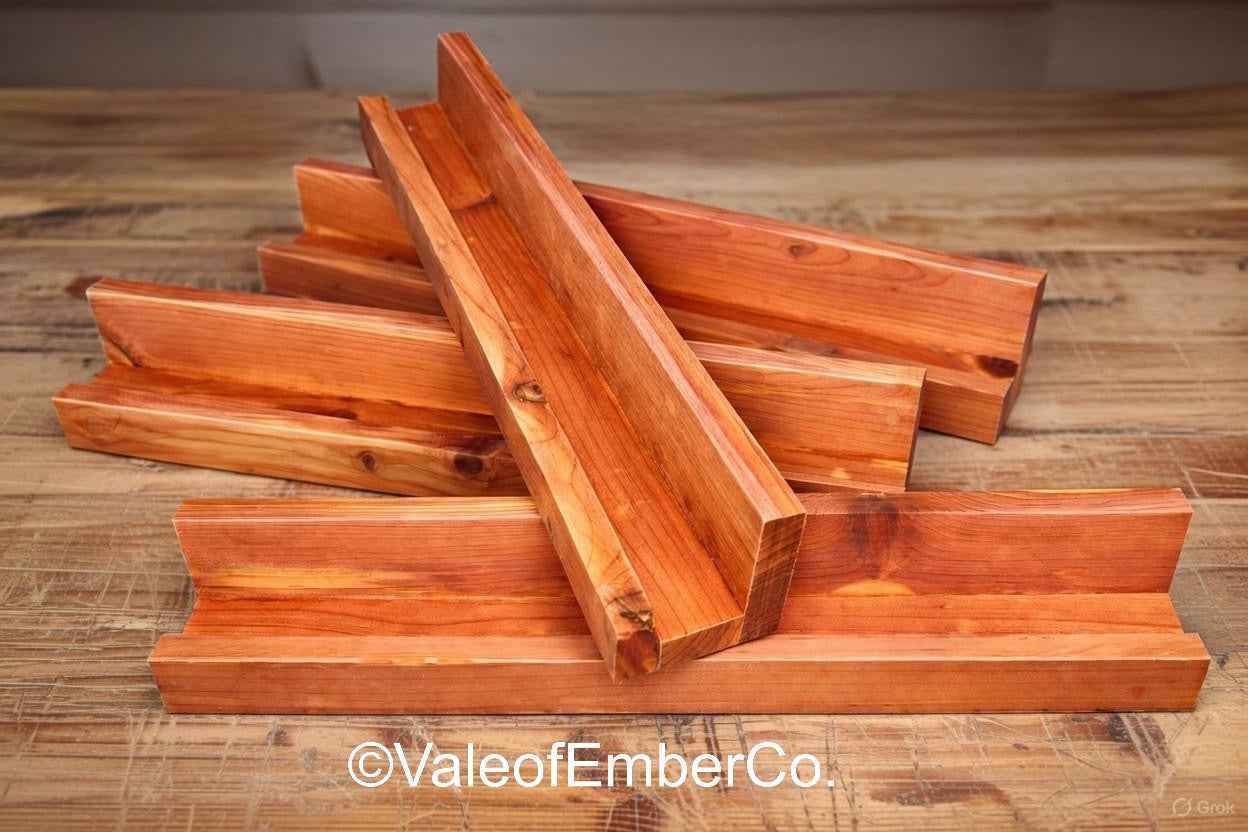 Stack of wooden planks on a wooden surface with 'ValeofEmberCo' branding. Domino/Scrabble Holder
