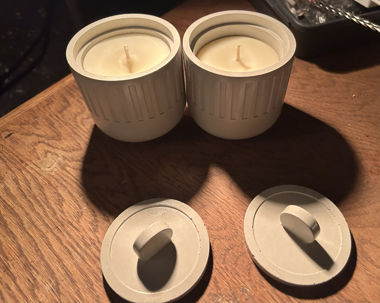 Tallow candles in handmade concrete vessels by Vale of Ember Co.